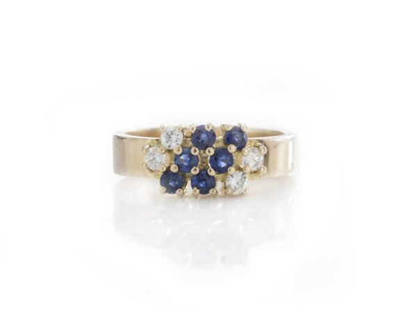 Chaumet Vintage Sapphire and Diamond Cluster Ring; set with 0.42cts blue sapphires and 0.28cts diamonds, in 18ct yellow gold, Signed