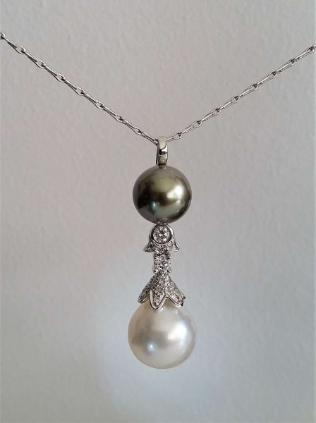 Tahitian Pearl, South Sea Pearl and Diamond Pendant; 11mm grey Tahitian pearl, 13mm South Sea Pearl and 0.35ct diamonds, 18ct white gold chain
