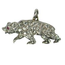 Diamond, Ruby and Platinum Bear Charm Pendant; diamond set platinum charm pendant designed as a bear, with a ruby eye, subtle fur engraving to body