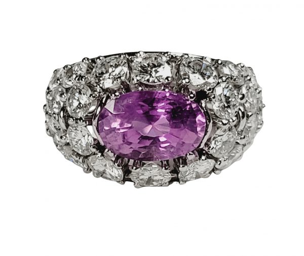 Vintage Pink Sapphire and Diamond Dress Ring; central certified 3.23ct oval natural pink sapphire surrounded by 4.30cts brilliant cut diamonds, in platinum, French, Circa 1960