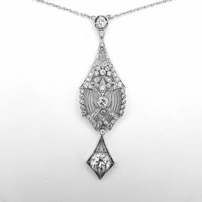 Belle Epoque 1.50ct Diamond and Platinum Pendant; combining floral and geometric designs. Central diamond estimated 1.50 carats