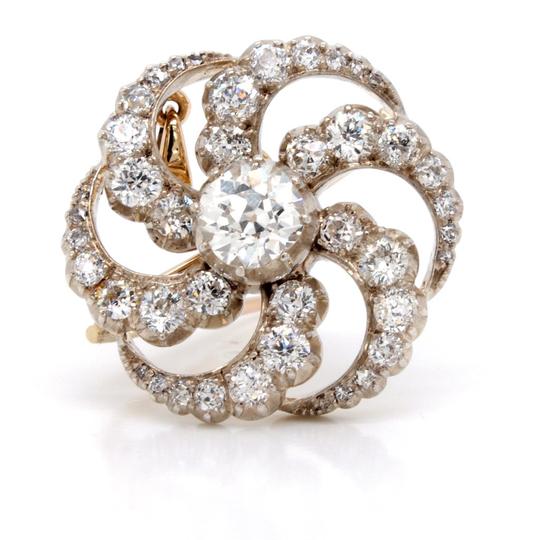 Antique Edwardian 2.60ct Old Cut Diamond Catherine Wheel Brooch Pendant; central 1.20ct old cut diamond surrounded by six graduated diamond-set spokes, in silver and gold