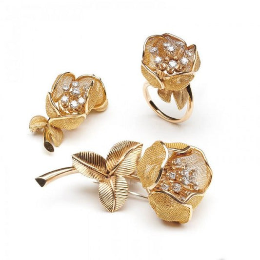 Vintage Piaget 18ct Gold and Diamond Flower Suite, comprising a ring and two brooches, articulated gold mesh set with diamonds, Circa 1960