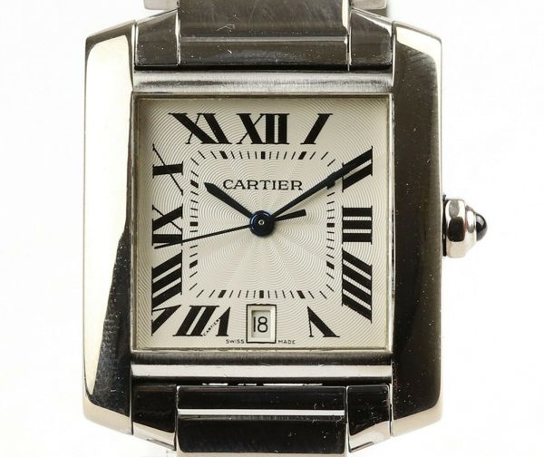 Cartier Gents Tank Française 18ct White Gold 28mm Automatic Rectangular Watch, silver guilloche dial, black Roman numerals, date aperture at 6, sapphire crystal glass, cabochon blue gem set crown, on Cartier 18ct bracelet with hidden double deployment clasp. With Cartier booklet and certificate dated 2006.