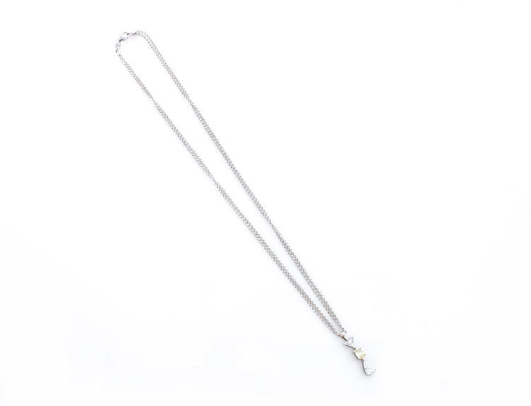 Filk Italian Diamond Drop Pendant Necklace, 1.55 carat total, oval fancy yellow diamond, triangular and pear-cut diamond, VVS clarity, F colour, Circa 1990's