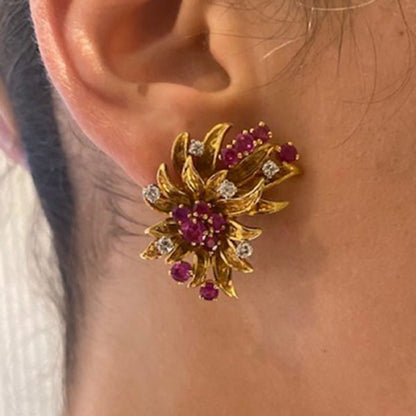 Vintage Ruby, Diamond and 18ct Yellow Gold Floral Earrings; designed as gold petals set with 3.50cts round-cut rubies and 0.75cts round brilliant-cut diamonds, Circa 1960