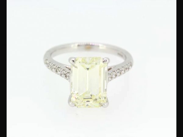 Exquisite Emerald cut solitaire diamond weighing 4.14 carats set with round brilliant cut diamond shoulders totaling 0.24 carats, 18ct white gold. 