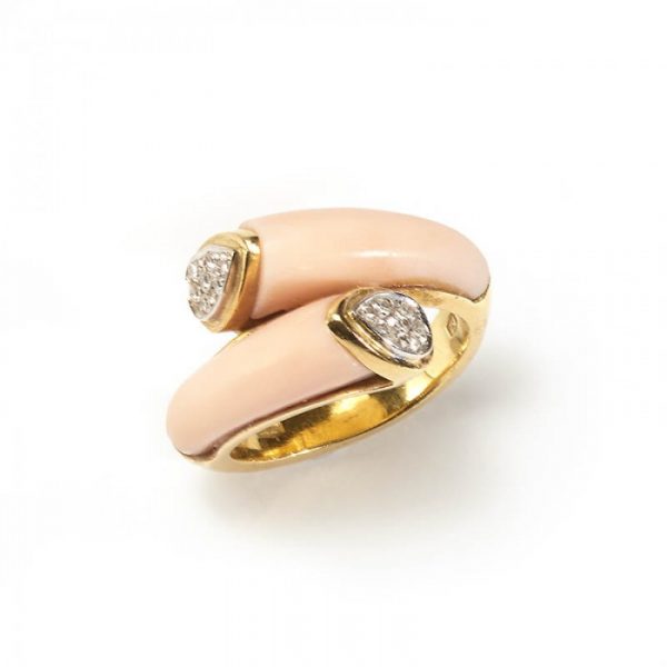 Contemporary Italian Coral and Diamond Crossover Ring; two tapering carved polished coral pieces with pave-set round single-cut diamond terminals, in 18ct yellow gold, Circa 1970s