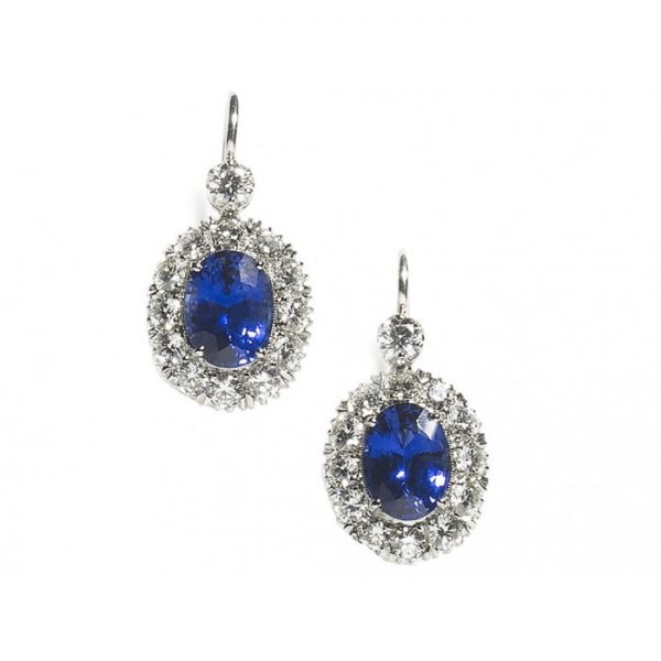 Sapphire, Diamond and Platinum Oval Cluster Drop Earrings; featuring 2.43ct oval faceted sapphires surrounded by round brilliant-cut diamonds, suspended from a single round brilliant cut diamond