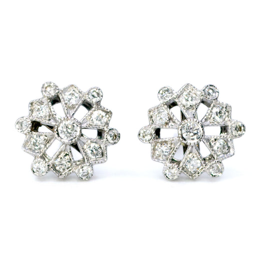 A pair of diamond snowflake design stud earrings in white gold