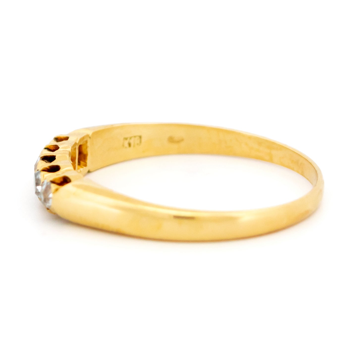 A five stone diamond ring in yellow gold
