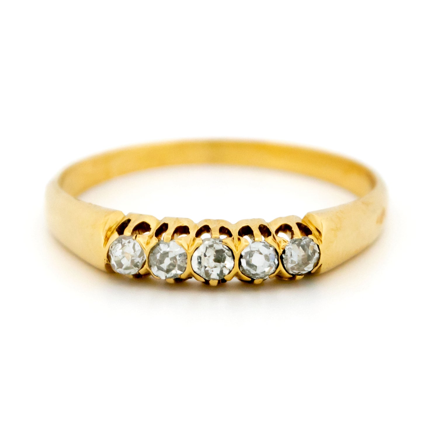 A five stone diamond ring in yellow gold