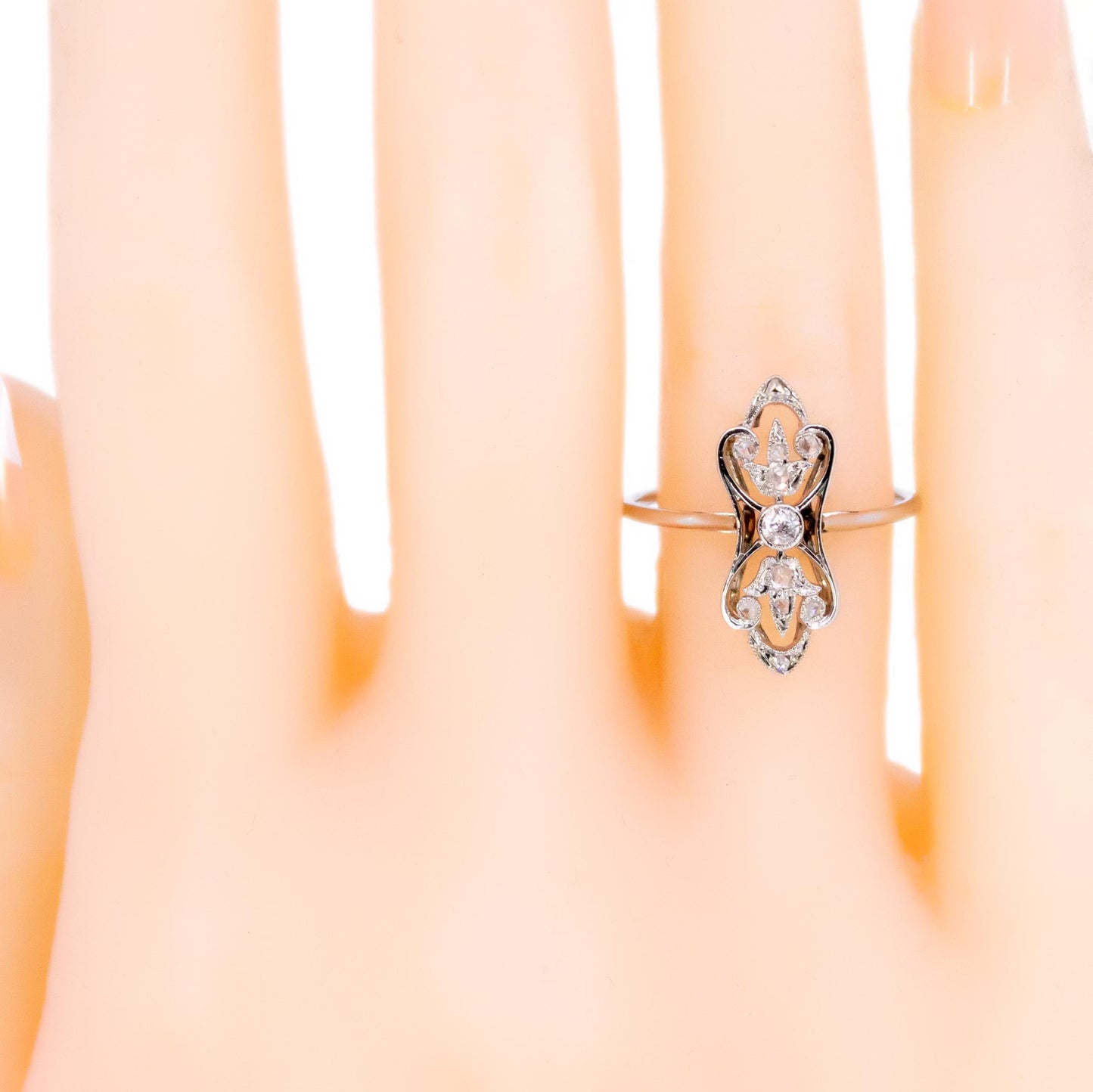 A diamond elongated ring in platinum, modelled on a hand