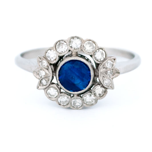 A sapphire and diamond flower shaped cluster ring in platinum