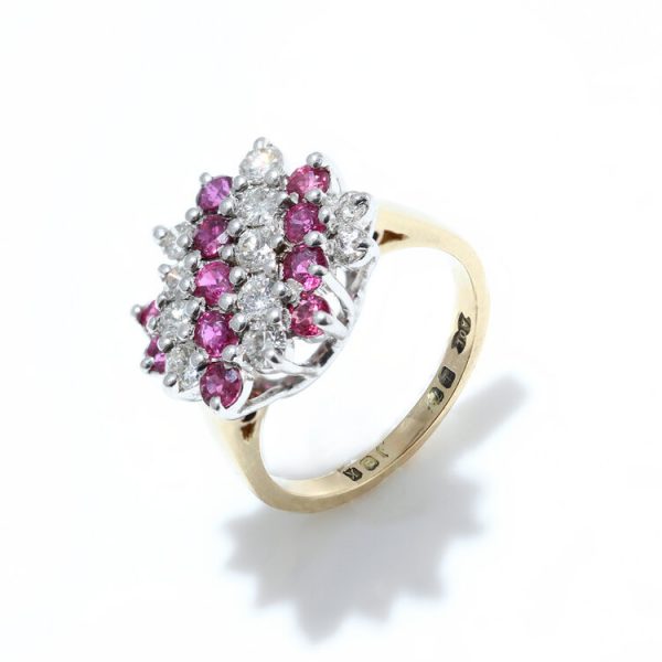 Vintage Ruby and Diamond Cluster Dress Ring; set with 0.53cts round brilliant-cut diamonds and 0.53cts rubies, in 18ct yellow gold, Circa 1984