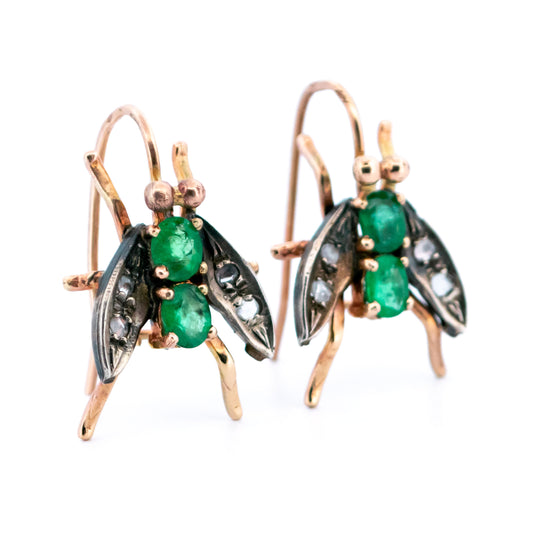 A pair of emerald and diamond insect earrings in yellow gold