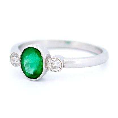 Vintage 14 Carat White Gold Oval Emerald and Old Mine-Cut Diamond Three Stone Ring