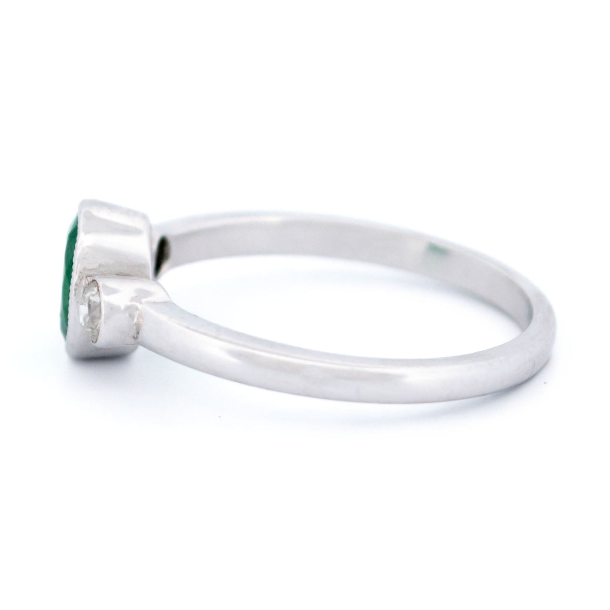 Vintage 14 Carat White Gold Oval Emerald and Old Mine-Cut Diamond Three Stone Ring