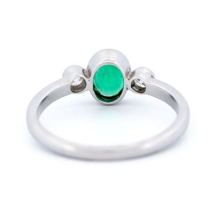 Vintage 14 Carat White Gold Oval Emerald and Old Mine-Cut Diamond Three Stone Ring
