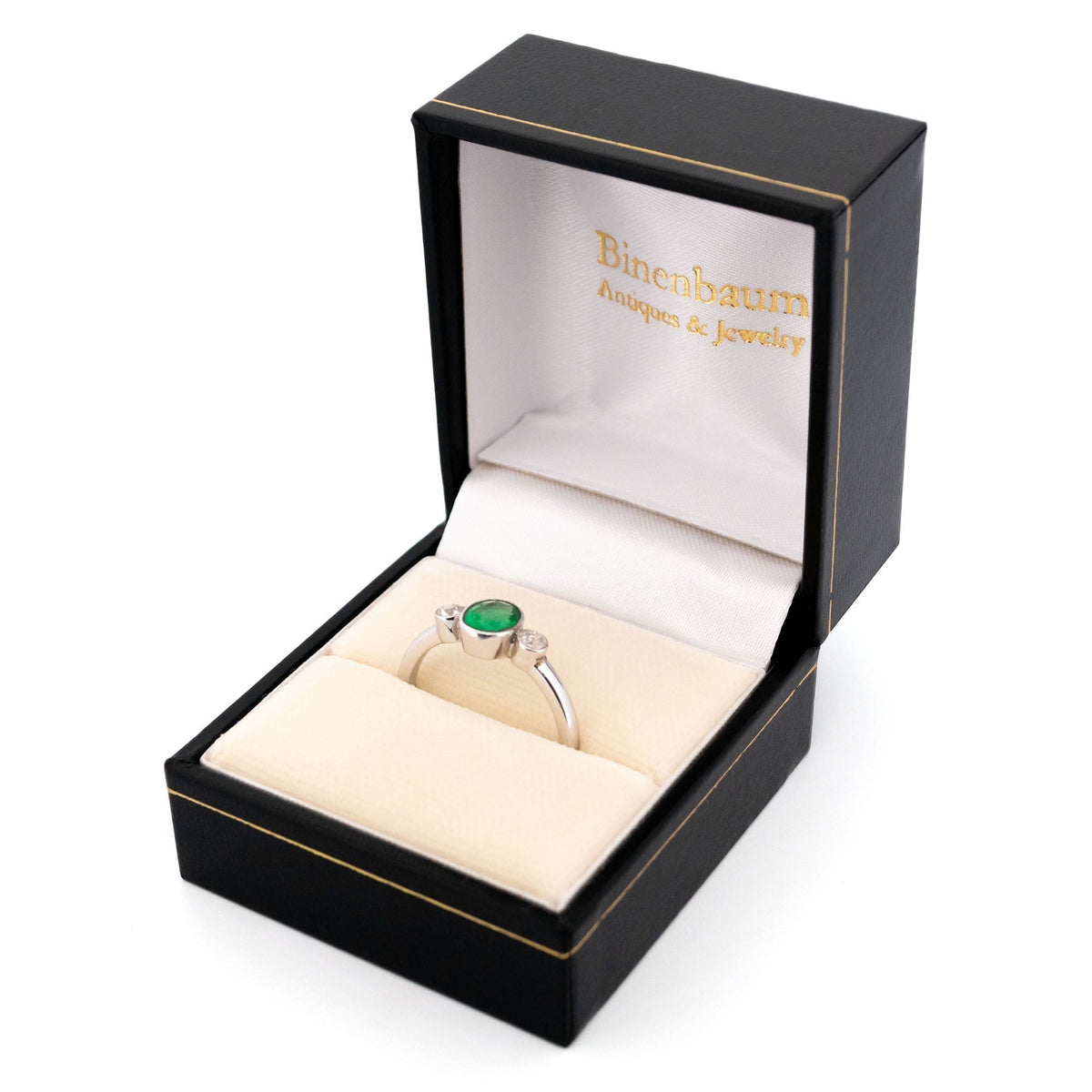 Vintage 14 Carat White Gold Oval Emerald and Old Mine-Cut Diamond Three Stone Ring