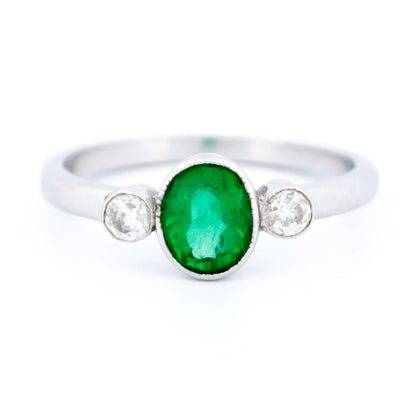 Vintage 14 Carat White Gold Oval Emerald and Old Mine-Cut Diamond Three Stone Ring