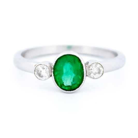 Vintage 14 Carat White Gold Oval Emerald and Old Mine-Cut Diamond Three Stone Ring