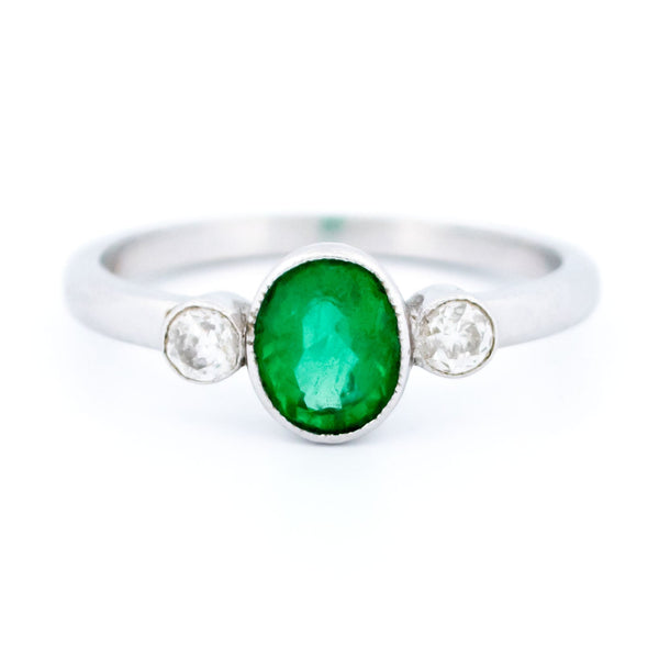 Vintage 14 Carat White Gold Oval Emerald and Old Mine-Cut Diamond Three Stone Ring