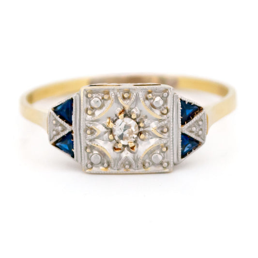 A square shaped ring in yellow and white gold with sapphires and diamonds