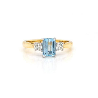 Emerald Cut Aquamarine and Diamond Three Stone Ring; 0.91ct emerald-cut aquamarine flanked by brilliant-cut diamonds totalling 0.25cts, 18ct yellow gold.
