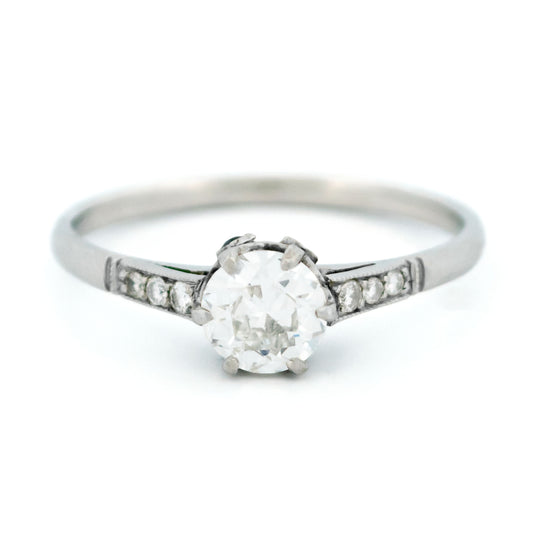 A platinum diamond ring with diamond shoulders