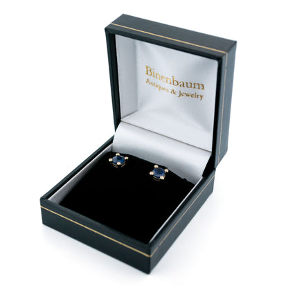 A pair of round sapphire and diamond stud earrings in yellow gold, in a box