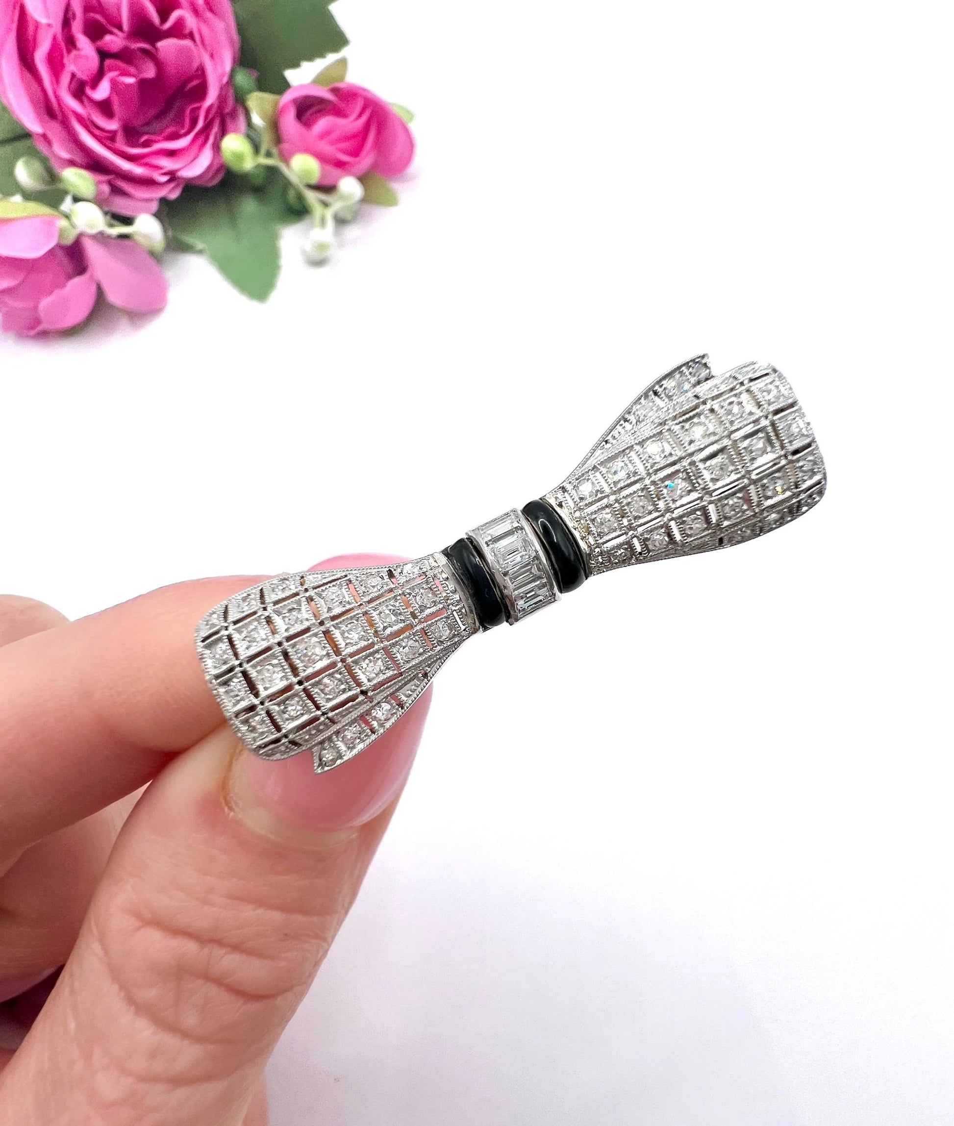Art Deco 14 Carat White Gold Onyx and Diamond Bow Brooch, Circa 1920