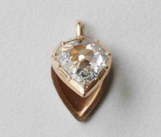 Bell and Bird Old Cut Pear Shaped Diamond Set 18ct Gold Locket; 18ct yellow gold locket pendant set with a large 3.13 carat flat old-cut pear-shaped diamond