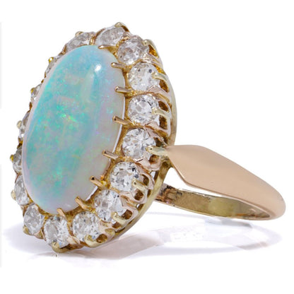 Victorian Antique Opal and Diamond Cluster Engagement Ring, oval cabochon opal surrounded by 1.12cts old-cut diamonds in 14ct yellow gold
