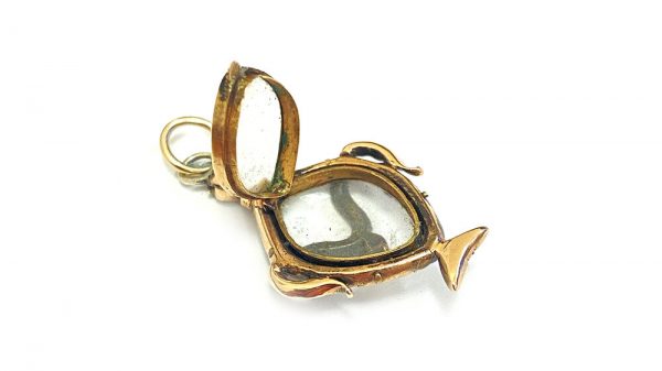 Antique Georgian Rock Crystal, Ruby and Pearl Locket Pendant; central rock crystal locket surrounded with rubies and seed pearls, 15ct yellow gold, 18th century, Circa 1760s