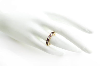 Garrard Princess Cut Ruby and Diamond Half Eternity Ring, 0.64ct princess-cut rubies and 0.48cts princess-cut diamonds, in 18ct Yellow Gold