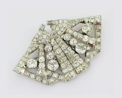 6.50ct Diamond Double Clip Butterfly Brooch; crafted from platinum, In the form of a geometric butterfly. Total diamond weight: 6.50 carats