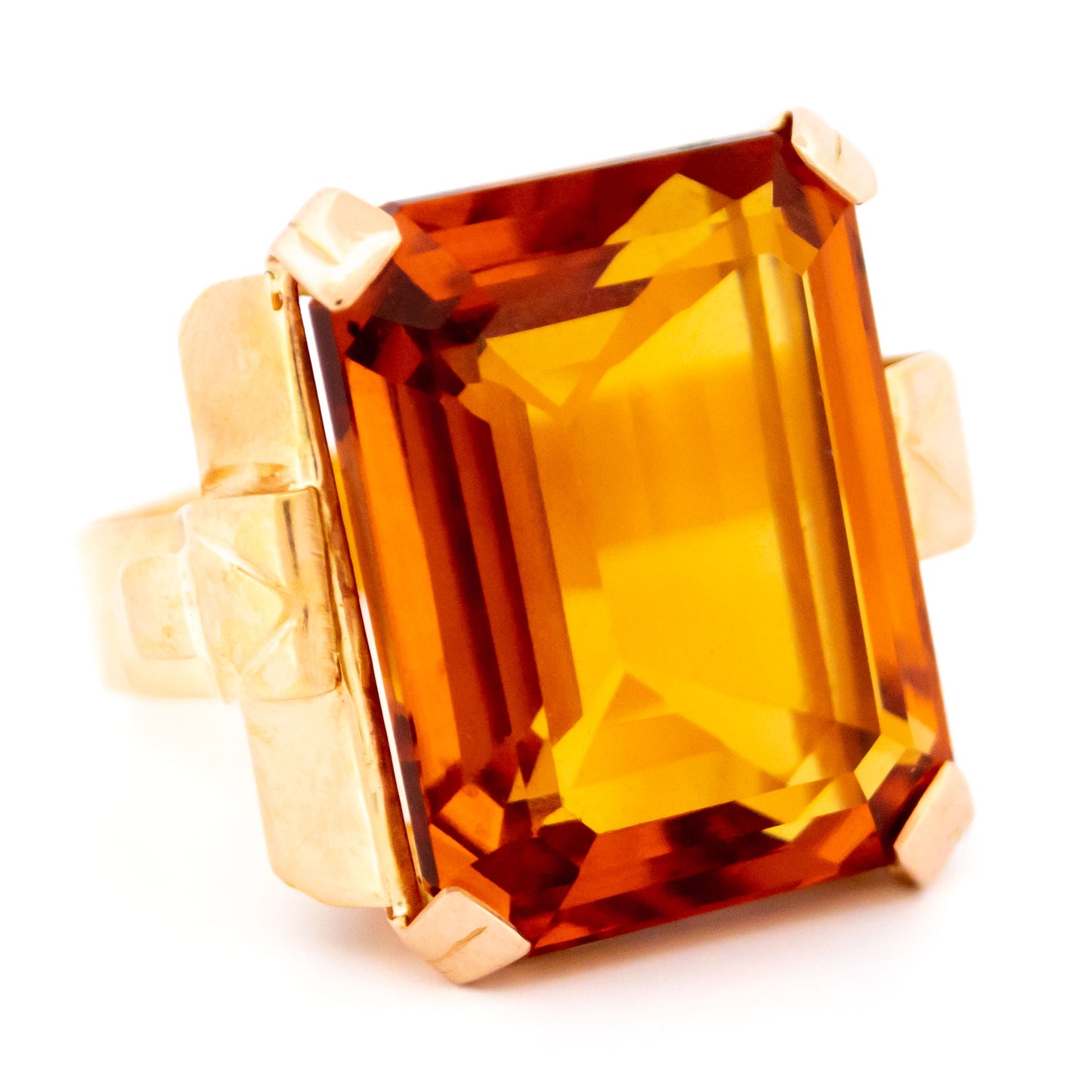 A large citrine solitaire dress ring in yellow gold