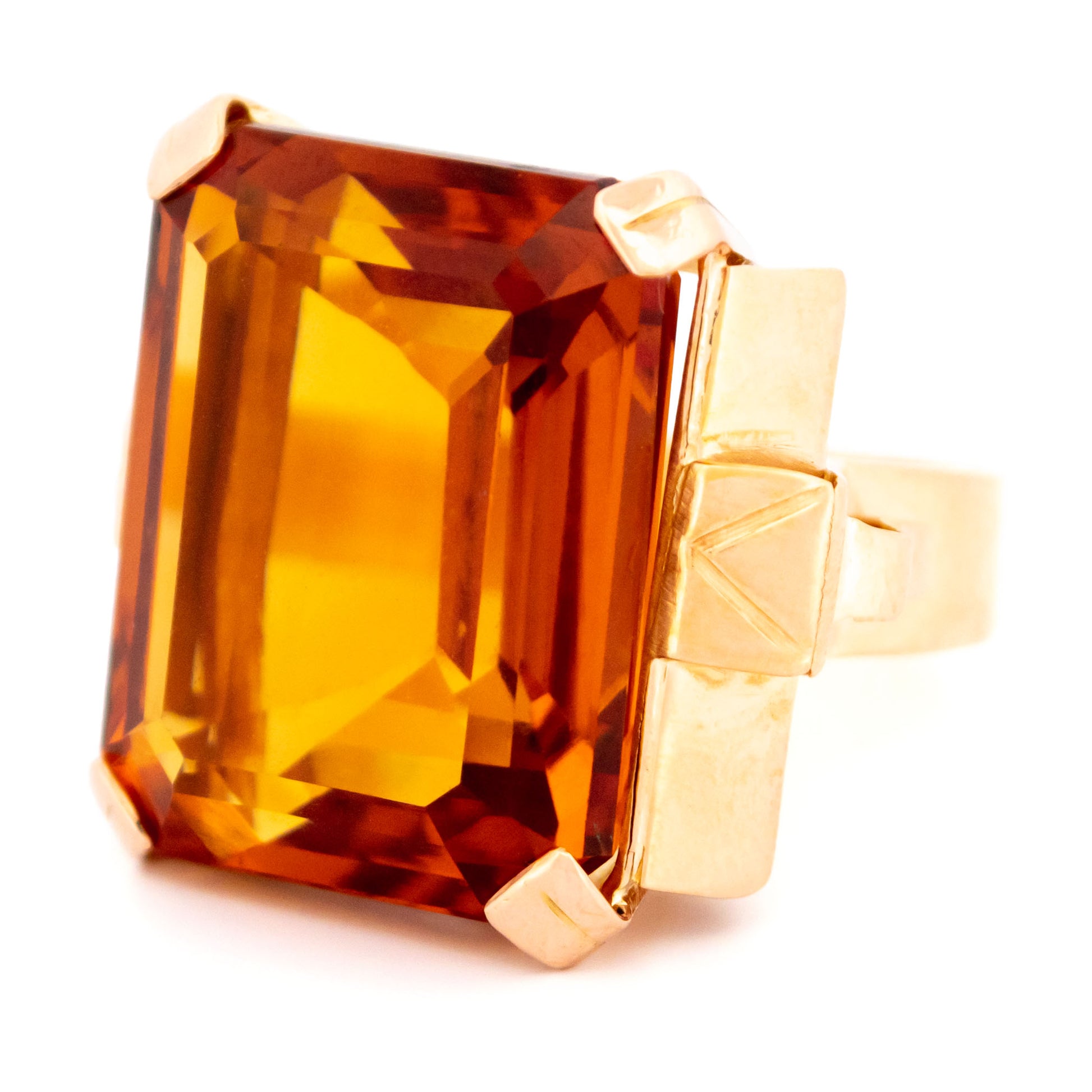 A large citrine solitaire dress ring in yellow gold
