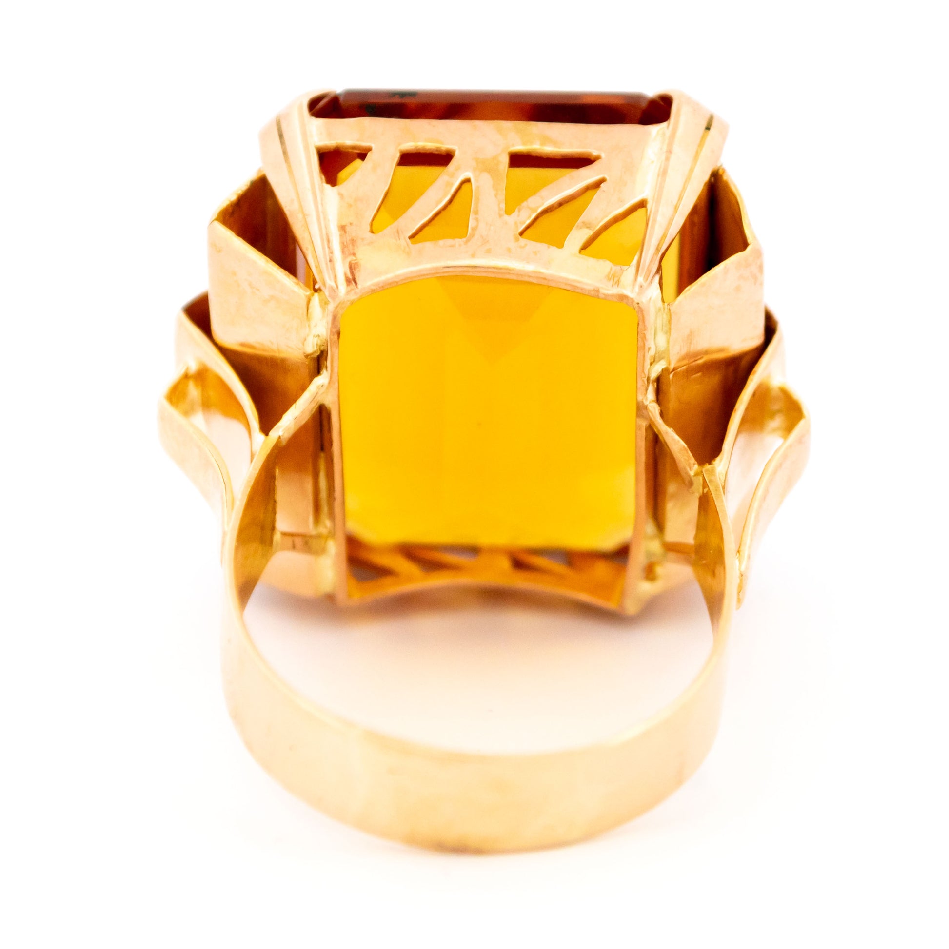 A large citrine solitaire dress ring in yellow gold