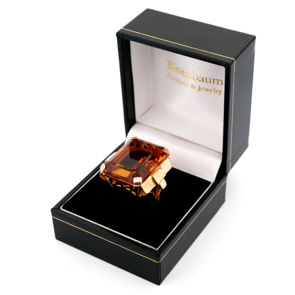 A large citrine solitaire dress ring in yellow gold, in a ring box