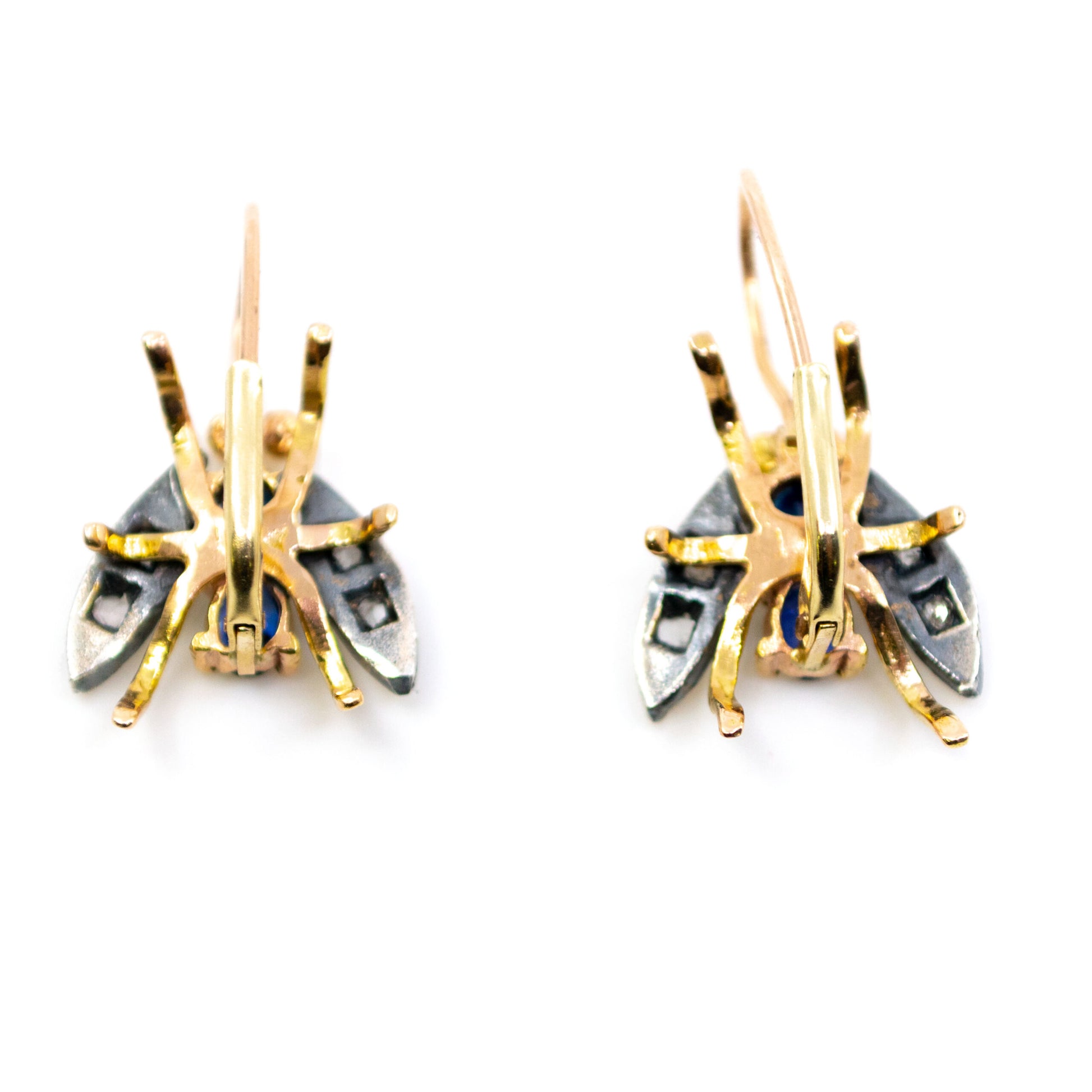 A pair of insect earrings in yellow gold and silver with sapphires and diamonds