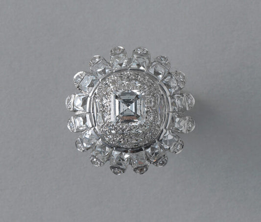 Vintage 10ct Diamond and Platinum Domed Cluster Bombe Cocktail Ring; set with carré, brilliant, French and single-cut diamonds, 10.00 carat total, Circa 1950s