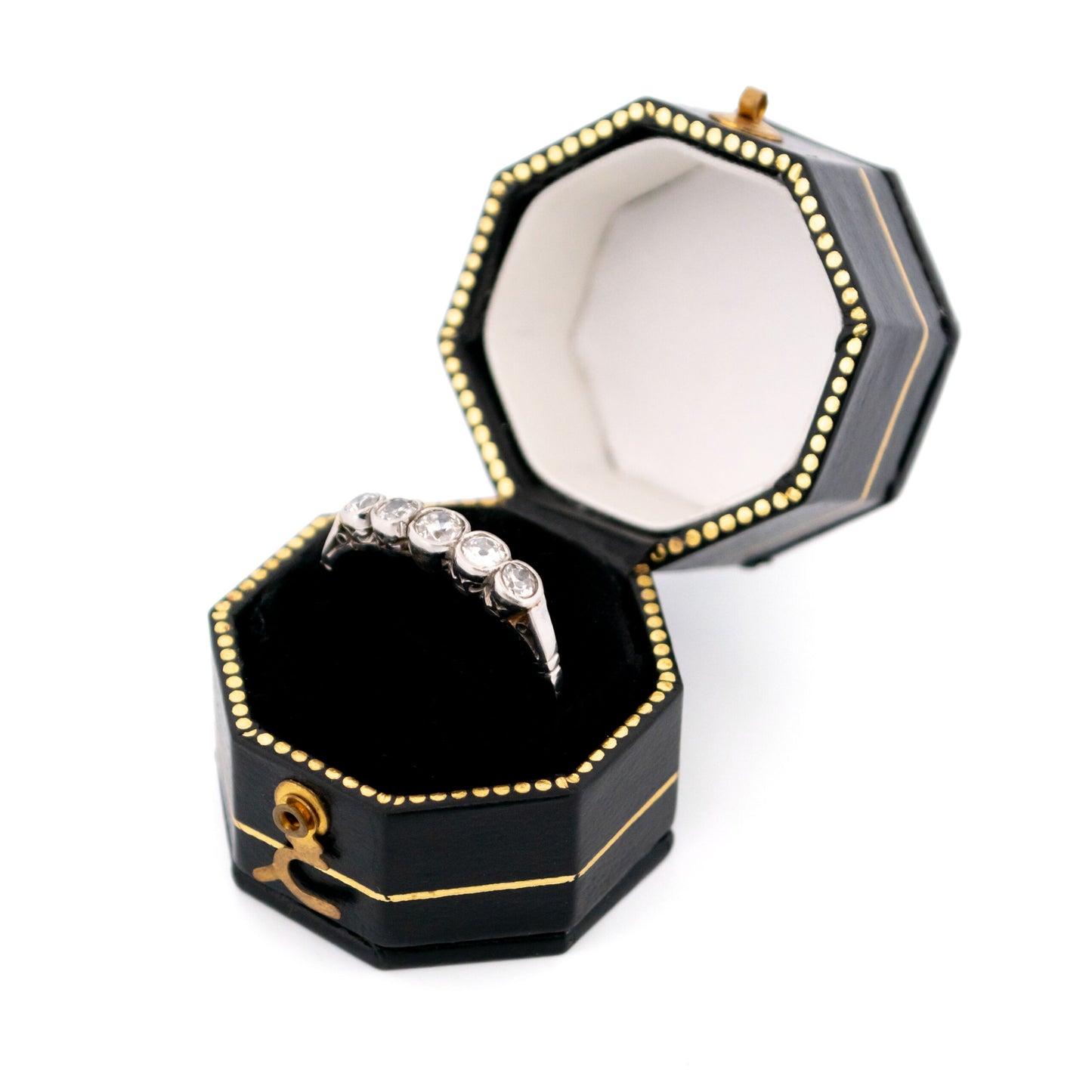 A five stone diamond ring in platinum, in a ring box