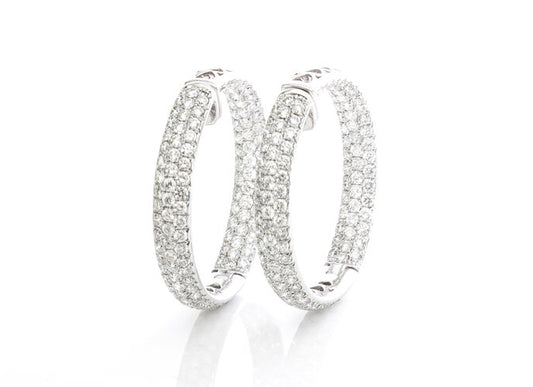 Diamond Hoop Earrings; featuring three rows of brilliant-cut diamonds, 8.19 carat total, in 18ct white gold with pierced heart detailing