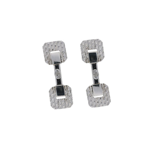 A pair of white gold octagonal face cufflinks with bar fittings, on a white background
