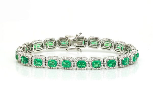 Colombian Emerald and Diamond Cluster Bracelet; featuring 9.02cts emerald-cut emeralds and 3.00cts brilliant cut diamonds, in 14ct White Gold