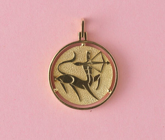 Vintage 18ct Yellow Gold Sagittarius Pendant; circular pendant featuring Sagittarius Zodiac star sign in relief on a textured background, with polished surround