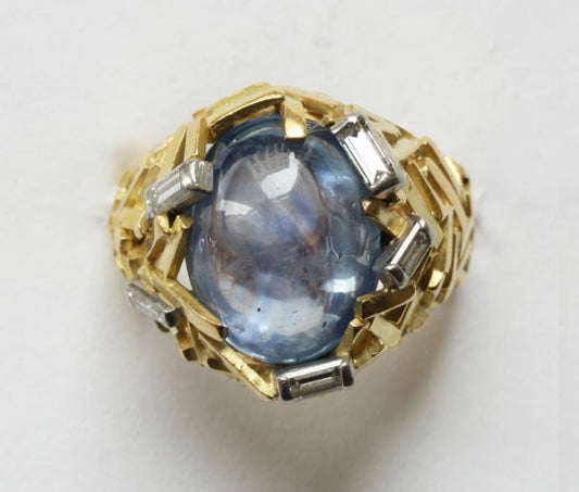 Vintage Cabochon Cut Ceylon Sapphire and Diamond Ring; Sri Lanka sapphire within striking ring composed of 18ct gold sticks, Signed Grima, Circa 1960-70s