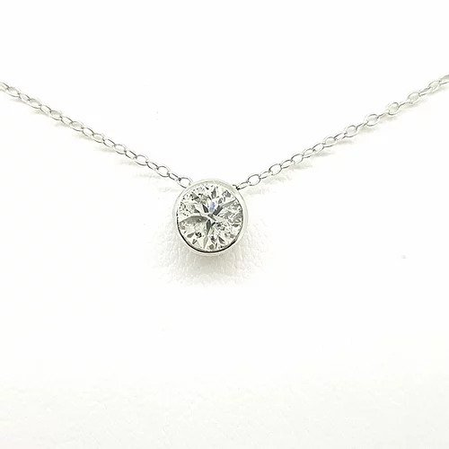 0.50ct Solitaire Diamond Pendant, featuring a 0.50ct brilliant-cut diamond, collet set in 18ct white gold, on a trace chain